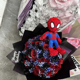 Spider-Man plush on a bouquet of red and black roses