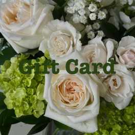 Cream roses and green hydrangeas in a gift card bouquet