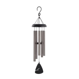 Black and silver wind chime hanging on a white background