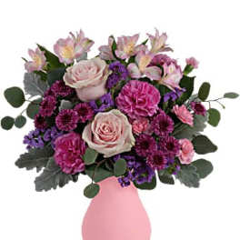 Pink and purple mixed bouquet in a pink vase