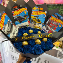 Blue rose bouquet with Hot Wheels toy cars and gold chocolates