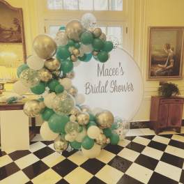 Balloon arch beside a sign reading "Macee's Bridal Shower"