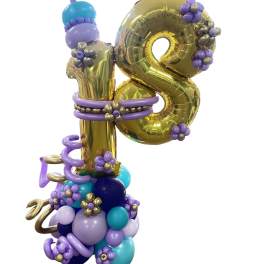 Gold balloon number 18 decorated with purple and blue balloons