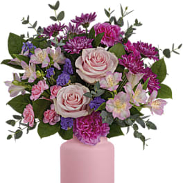 Pink and purple mixed bouquet in a pink vase