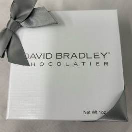 White chocolate gift box with a gray ribbon bow