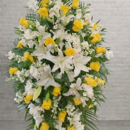 Standing floral spray with white lilies and yellow roses