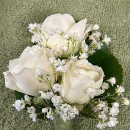 White rose and calla lily boutonniere with baby's breath