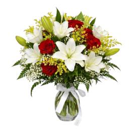 Bouquet of red roses and white lilies in a glass vase