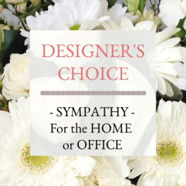 White daisy-like flowers with a sympathy sign in the center