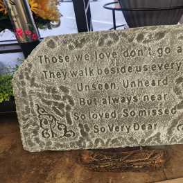 Memorial stone with an engraved sympathy poem