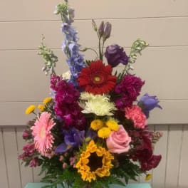 Colorful mixed flower arrangement in a glass vase