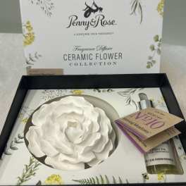 Ceramic flower fragrance diffuser gift set with a white rose and oil bottle