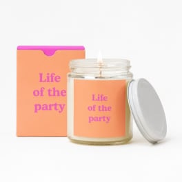 Lit candle in a glass jar with a matching box and lid