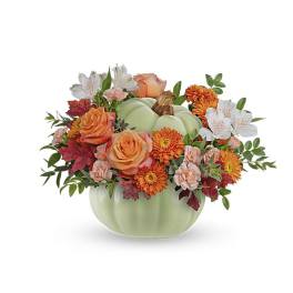 Pumpkin-shaped vase with orange and white flowers