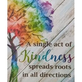 Rainbow tree graphic with kindness quote on wood background