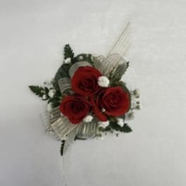 Red rose boutonniere with white filler and ribbon
