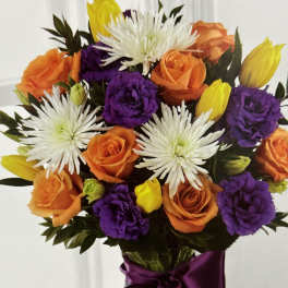 Bouquet of orange and purple roses with white spider mums and yellow tulips
