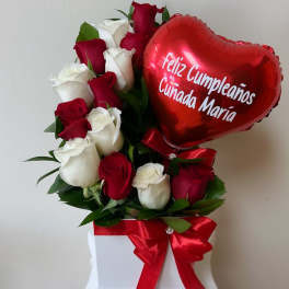 Red and white roses with a red heart balloon in a white box