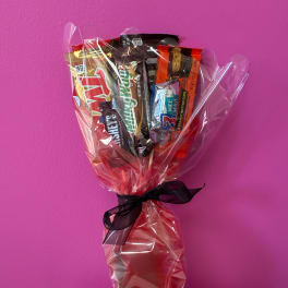 Candy bouquet wrapped in clear cellophane with a black ribbon