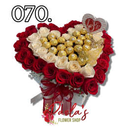 Heart-shaped bouquet of red and white roses with gold-wrapped chocolates