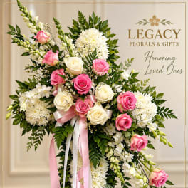Standing floral spray with pink and white roses and white chrysanthemums on ribbons