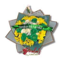 Yellow and green floral bouquet with a saint topper and ribbon