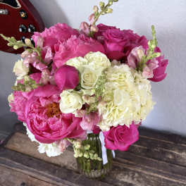 Pink and white flower bouquet in a glass vase