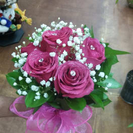 Pink rose bouquet with baby's breath and a pink ribbon wrap