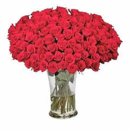 100 Premium Red Roses arranged in a glass vase