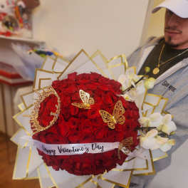 Large bouquet of red roses with white orchids and gold butterfly accents