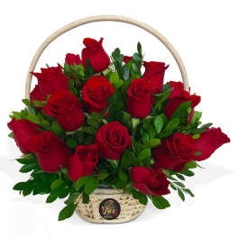 Basket of red roses with greenery and a handle