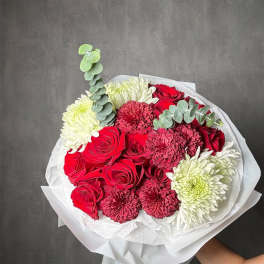 Bouquet of red roses and white chrysanthemums with eucalyptus