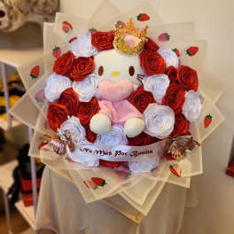Plush Hello Kitty bouquet surrounded by red and white roses