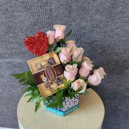Pink roses with a Ferrero Rocher box and red glitter heart in a gift box