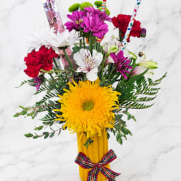 Colorful bouquet in a pencil vase with flowers and pencils