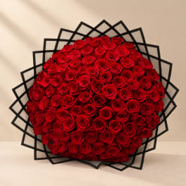 Large bouquet of red roses with black geometric wrap