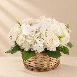 White flowers arranged in a wicker basket