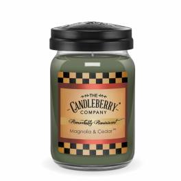 Green jar candle with black lid and labeled front
