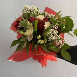 Hand arrangement of mixed flowers in your choice of color