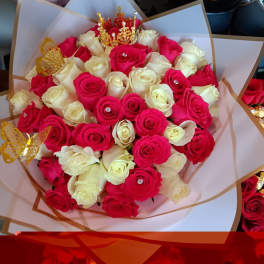 Bouquet of pink and white roses with gold butterfly picks