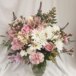 Pink and white mixed bouquet in a glass vase