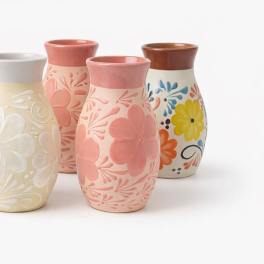 Five decorative ceramic vases with floral patterns in assorted colors
