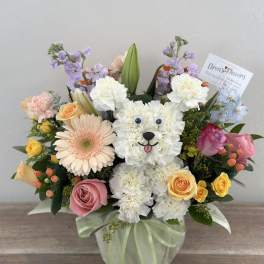 Flower arrangement shaped like a white teddy bear with roses and daisies