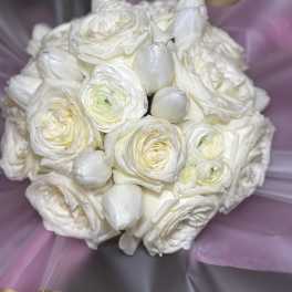 White rose and tulip bouquet wrapped in lavender paper