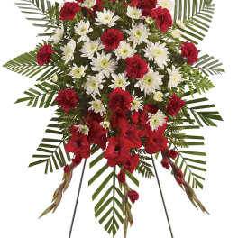 Standing red and white floral spray on an easel