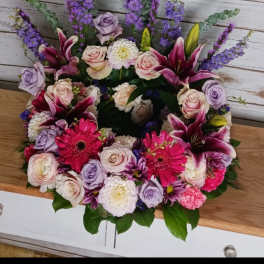 Mixed bouquet with pink lilies, roses, and purple flowers