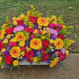 Bright mixed flower arrangement with roses, gerberas, and chrysanthemums