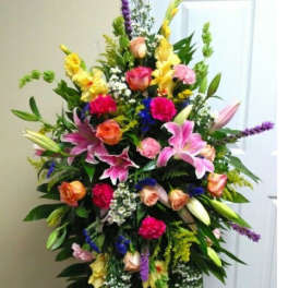 Tall mixed floral spray with pink lilies and roses
