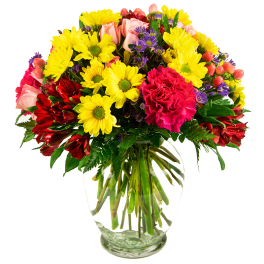 Mixed bouquet of yellow daisies, pink roses, and red flowers in a clear glass vase