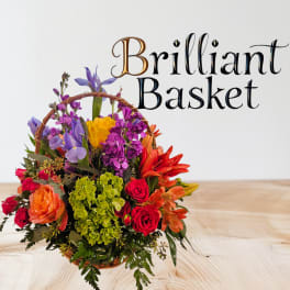 Colorful flower basket with roses, lilies, and purple blooms